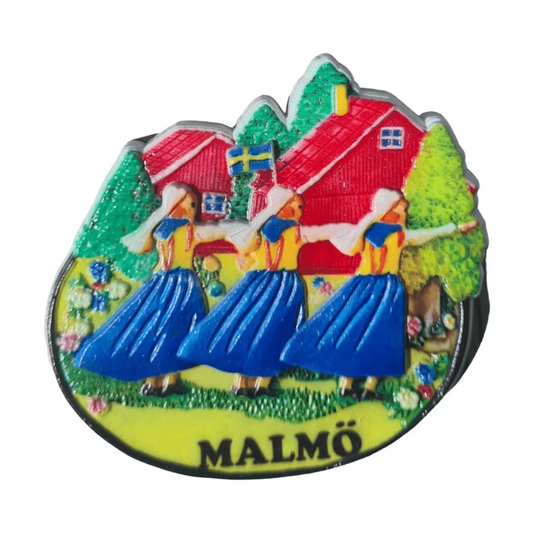Colorful 3D Malmö fridge magnet featuring traditional dancers and a Swedish house design