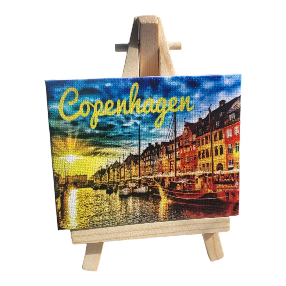 Copenhagen city canvas print featuring colorful buildings and a sunset on the water