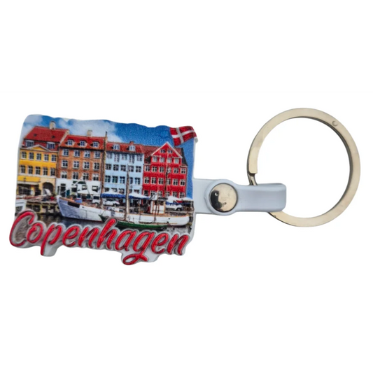 Copenhagen city keychain featuring colorful buildings and boats, perfect souvenir for travelers
