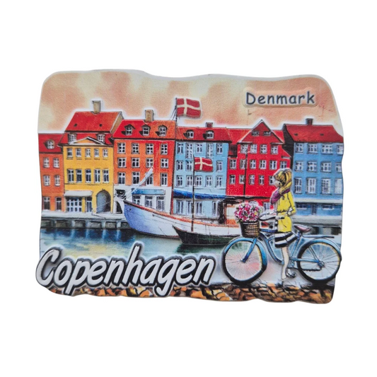 Colorful Copenhagen fridge magnet featuring scenic buildings and a cyclist with flowers
