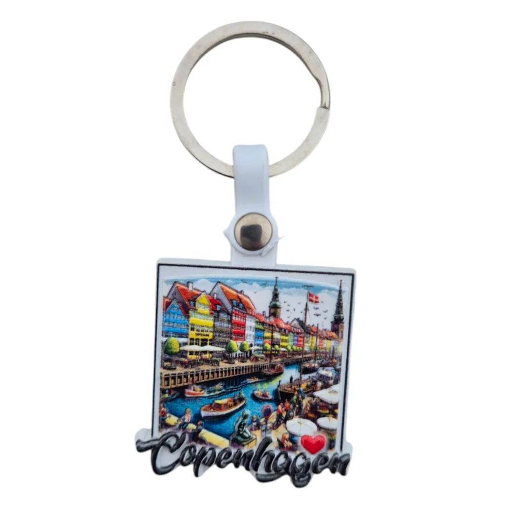 Copenhagen souvenir keychain featuring colorful Nyhavn waterfront and iconic buildings