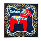 Colorful Sweden Dala Horse magnet on a decorative black background for souvenirs and collectors
